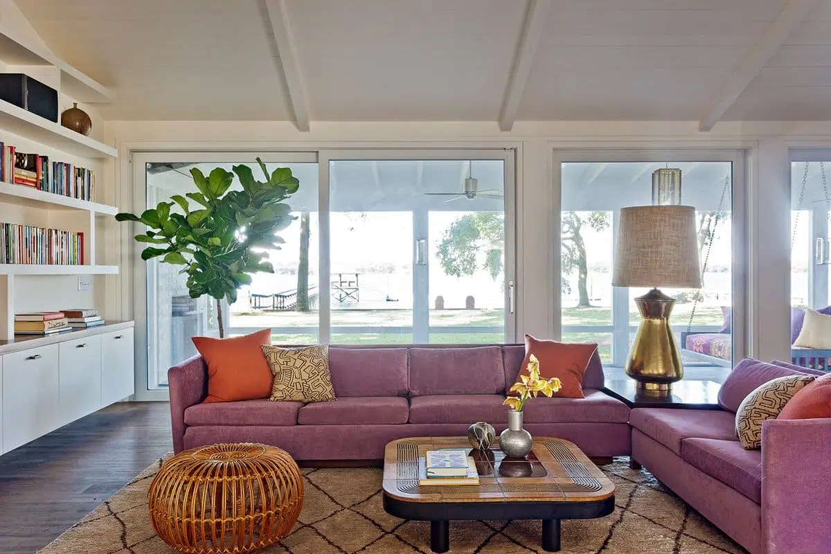 In the South Carolina home of a color-loving family, Angie Hranowsky added a touch of natural texture, with a Franco Albini rattan ottoman. 