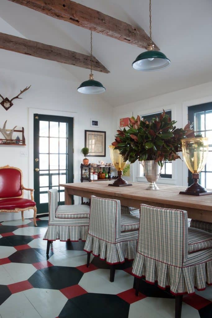 Painted wide-plank wood floors are an unexpected feature of this Nick Olsen–designed colonial in Dutchess County, New York.