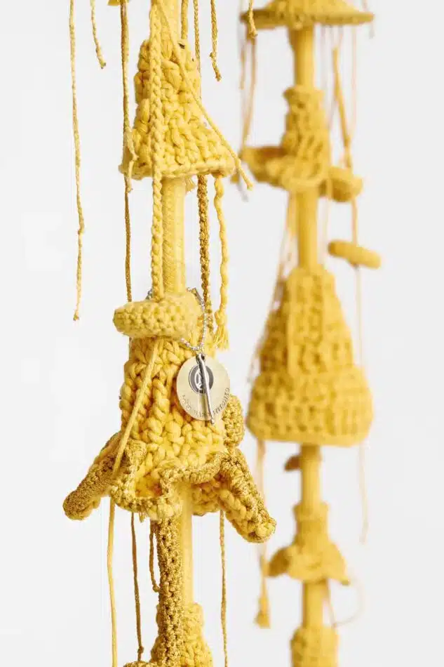 The hand-crocheted floral tassels of Iota's golden Enchanted Forest Swing