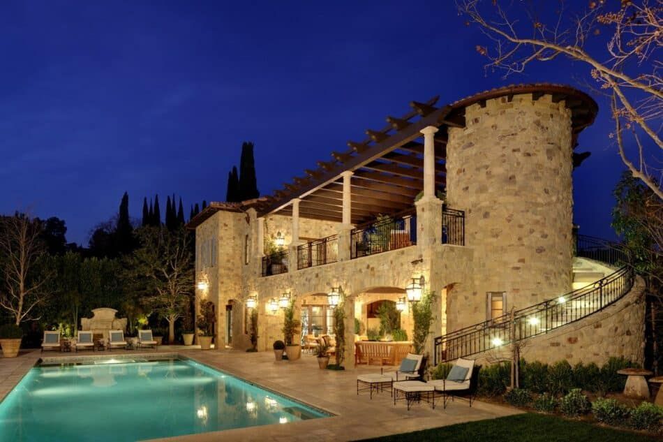Italian-style pool house designed by Landry Design Group
