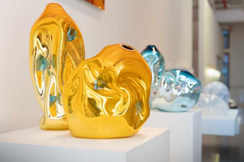 Unique crumpled sculptural vessel in orange glass with applied turquoise glass crystals