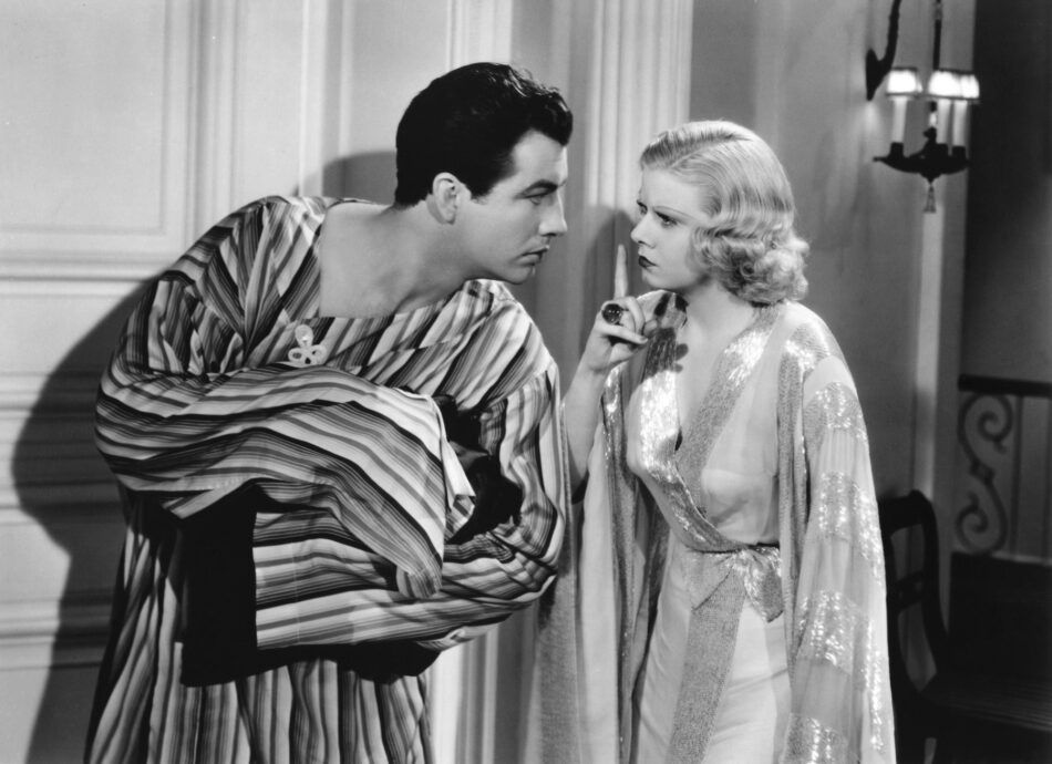 A black and white photo of Robert Taylor and Jean Harlow in a scene from the film "Personal Property"