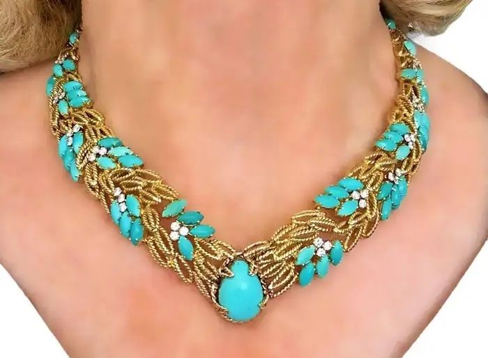 turquoise and gold necklace on model