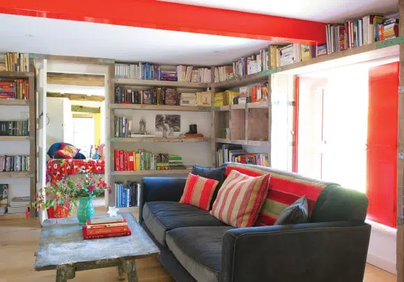 The living room of this countryside home in Devon, England, hums with bright color