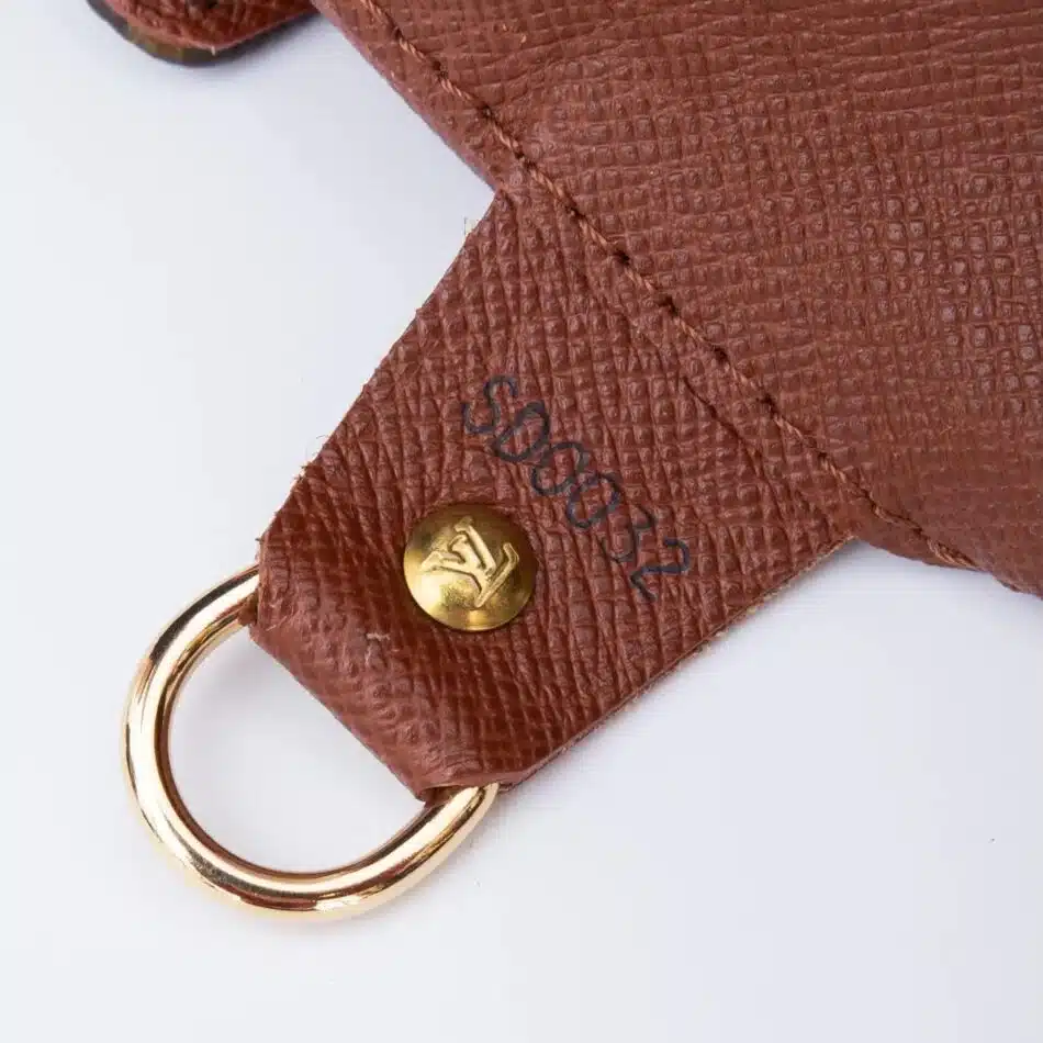 A close up photograph of a date stamp on the inside of a Louis Vuitton bag.