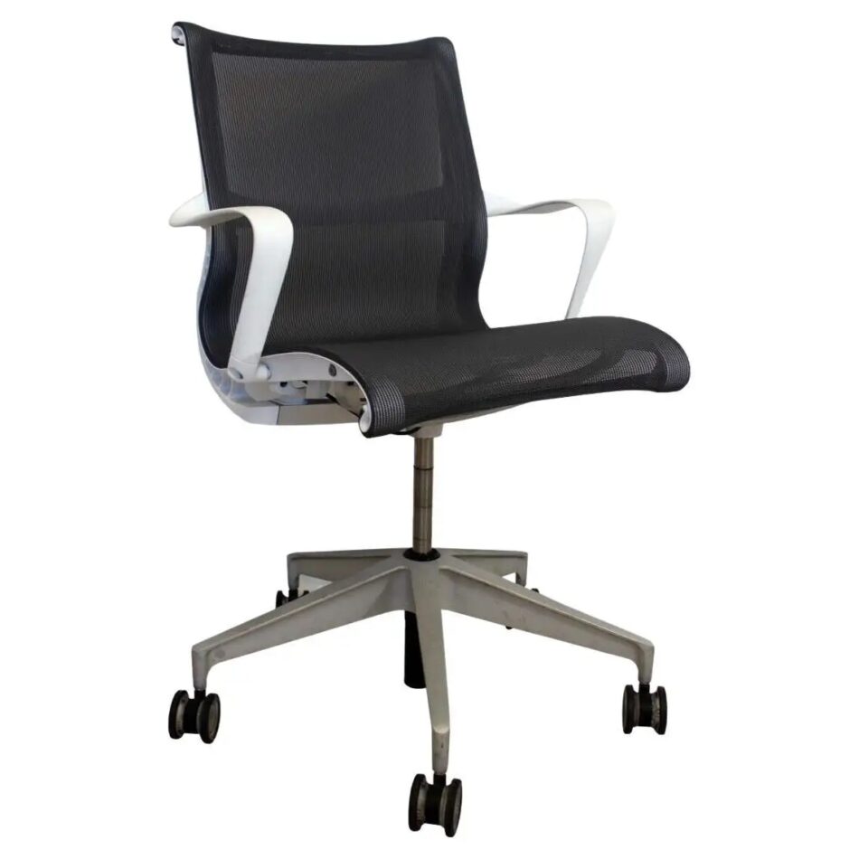 A Herman Miller Setu office chair with a white frame and a black mesh back and seat