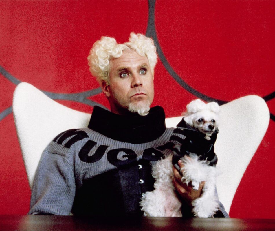 Will Ferrell as Mugatu in Zoolander sits in a white Egg chair.