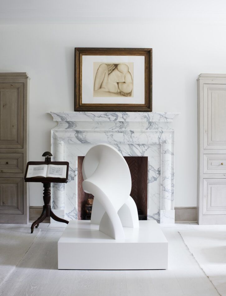 Whitewashed trad-meets-mod living room of a home in Washington, D.C., designed by Darryl Carter.