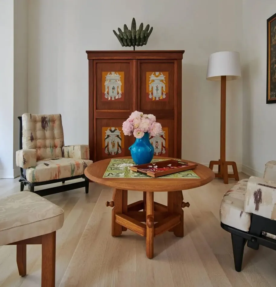 Interior featuring a Guillerme et Chambron adjustable coffee table