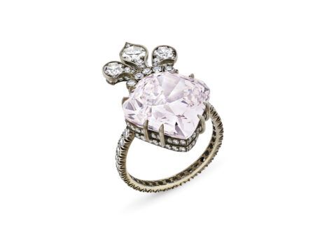 Ring with a purplish pink diamond