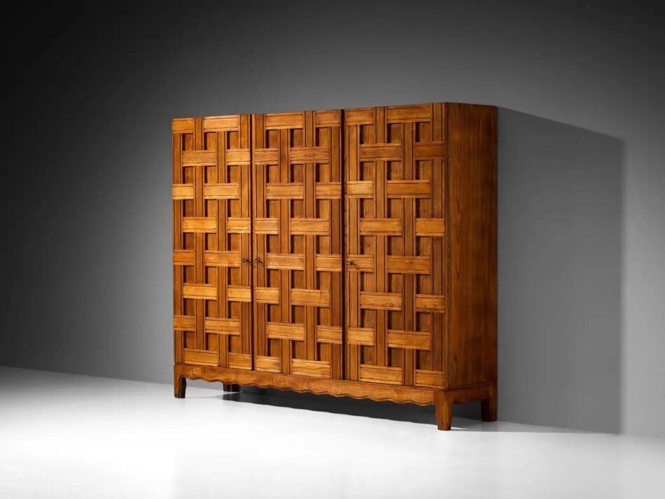 A large cabinet with wooden slats in a basketweave pattern on the doors by Italian furniture designer Paolo Buffa