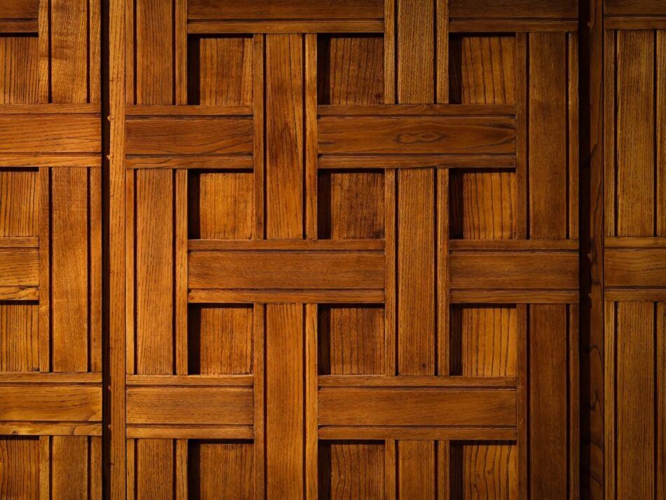 A close-up of the wooden slats in a basketweave pattern on the doors of a cabinet by Italian furniture designer Paolo Buffa