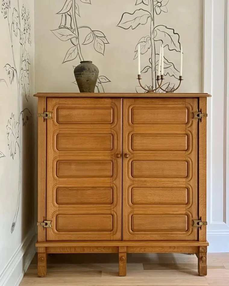 A Guillerme et Chambron cabinet in a dining room designed by Nate Berkus Associates