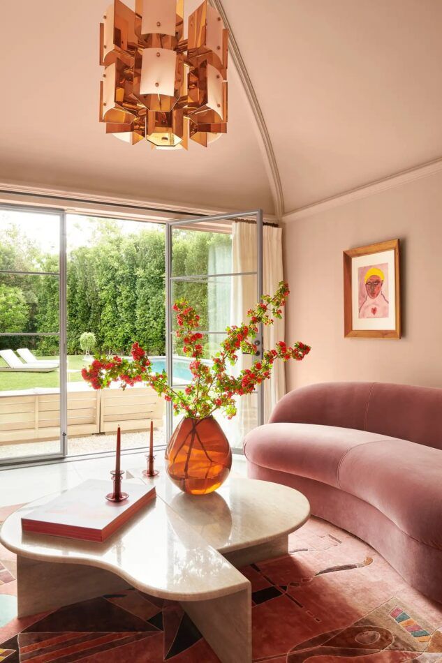 Tiffany Howell, founder of Night Palm, bathed this vaulted Los Angeles living room in shades of blush.