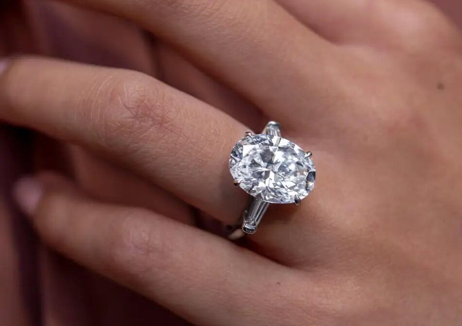 Roman Malakov 8.05-carat oval cut three-stone diamond ring, 2022
