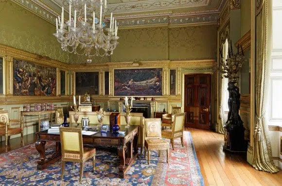At Buscot Park, an 18th-century neoclassical-style estate in Oxfordshire, England, designer Alidad added chartreuse-green silk damask to set off the salon’s famed “Briar Rose” paintings by Edward Burne-Jones
