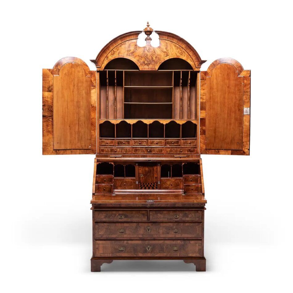 A Queen Anne–style burled-walnut secretary, shown with its cupboard doors open and drop-leaf down, revealing the shelves, drawers and cubbyholes inside