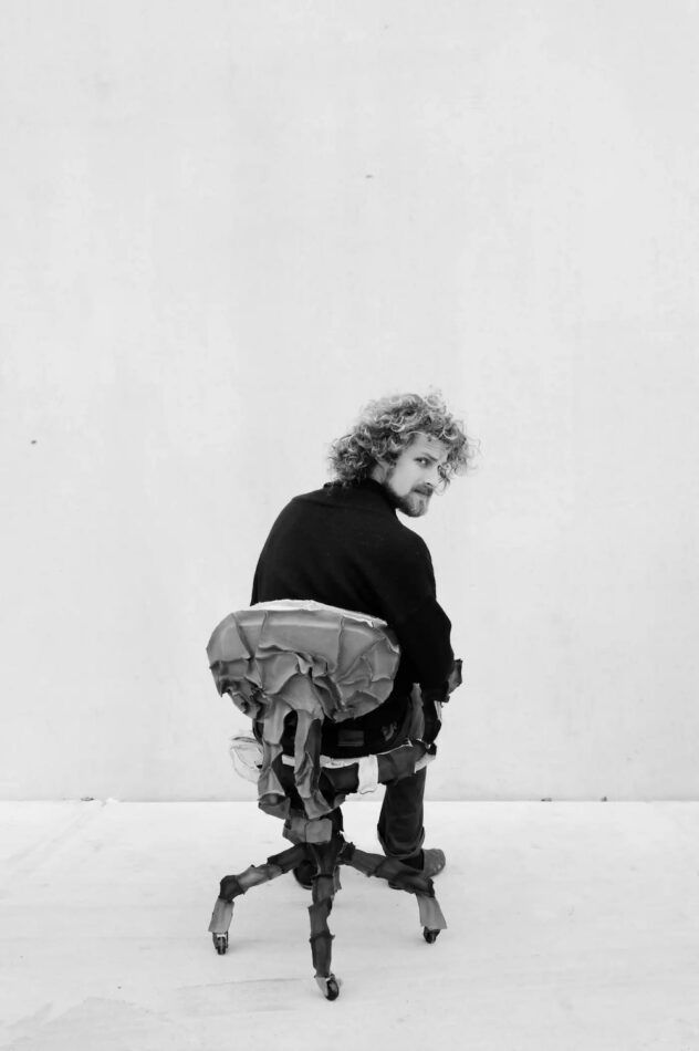 Pepe Heykoop in skin office chair