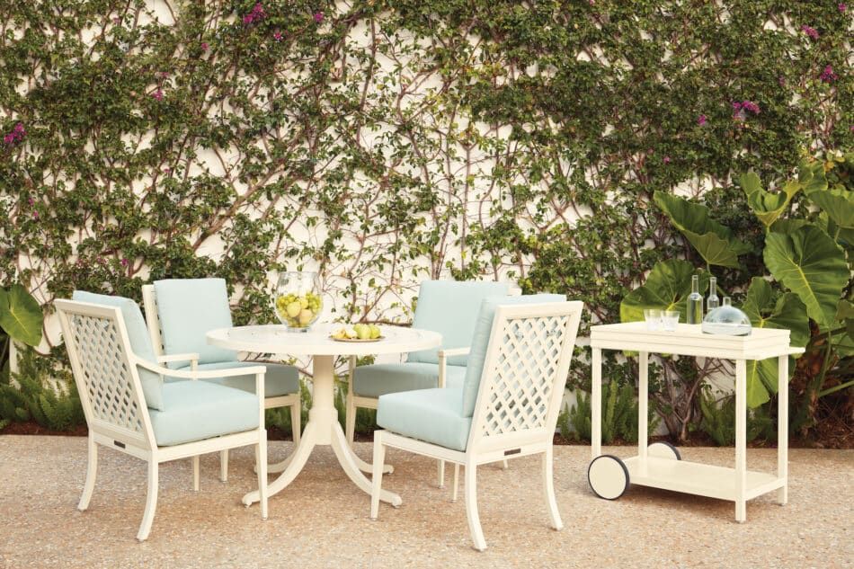 McKinnon and Harris dining furniture in a Mario Nievera–designed garden in Palm Beach.