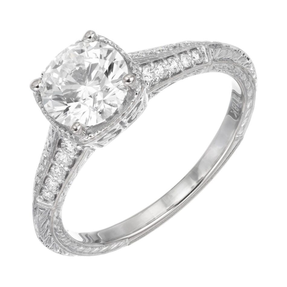 A bezel-cut diamond engagement ring, made with white gold