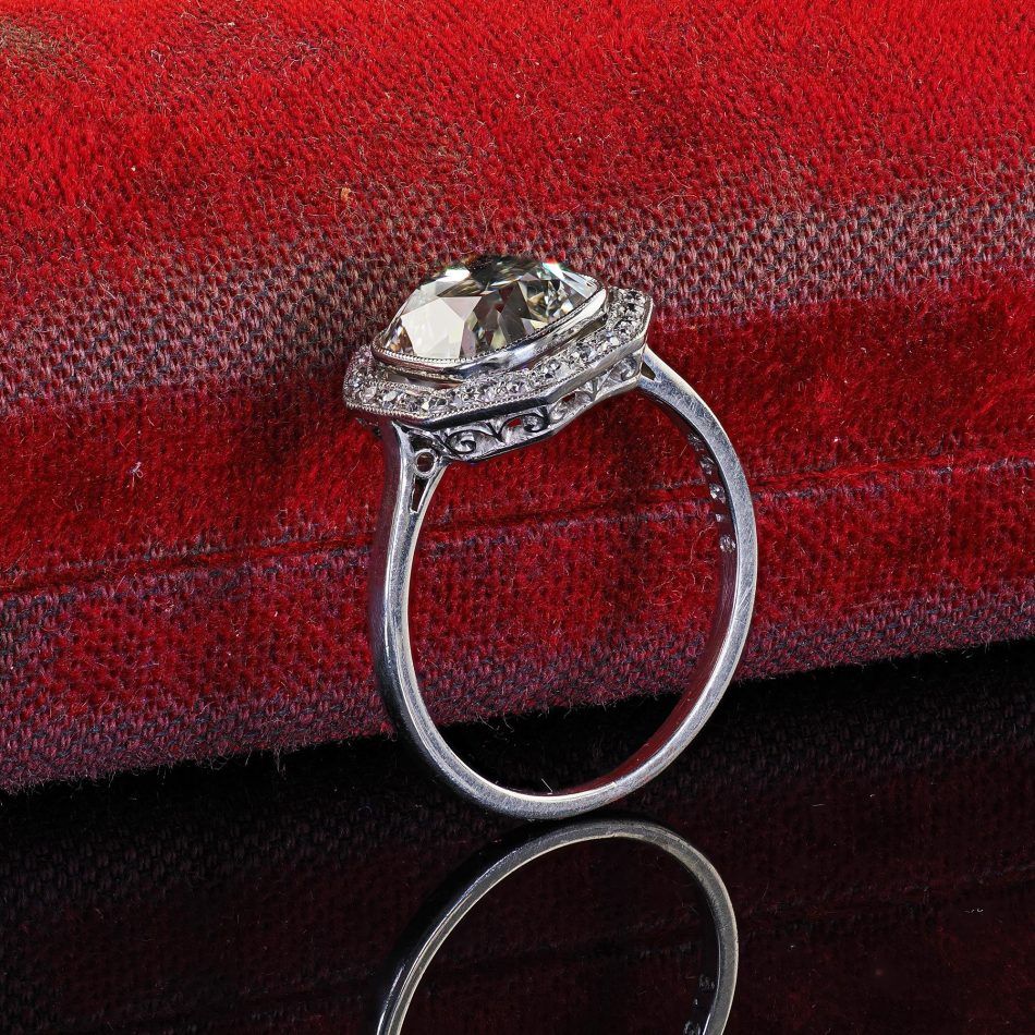 The engagement ring features filigree details