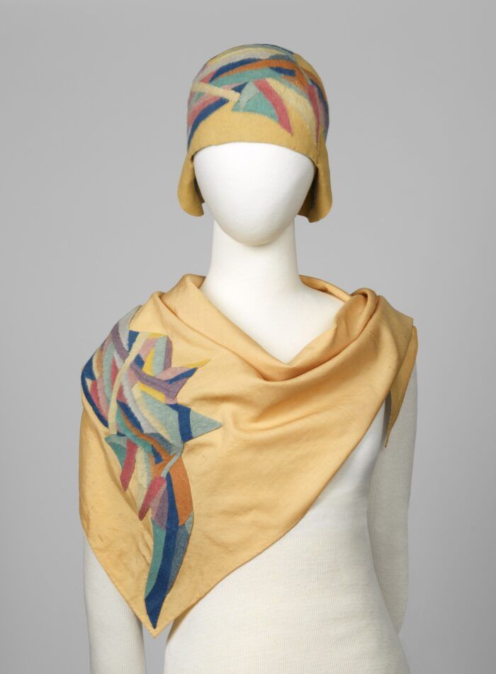 A 1924–25 yellow cloche and scarf by Sonia Delaunay partially decorated with a multicolor pattern