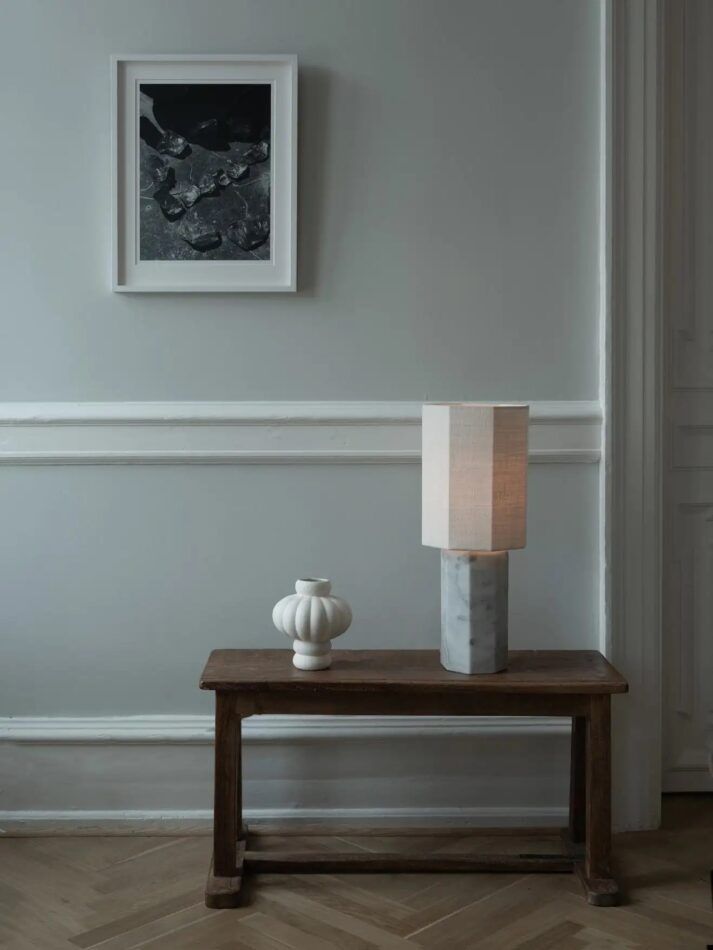 Louise Roe's Balloon Vase 02 on a small wooden table with her Eight Over Eight lamp in white marble