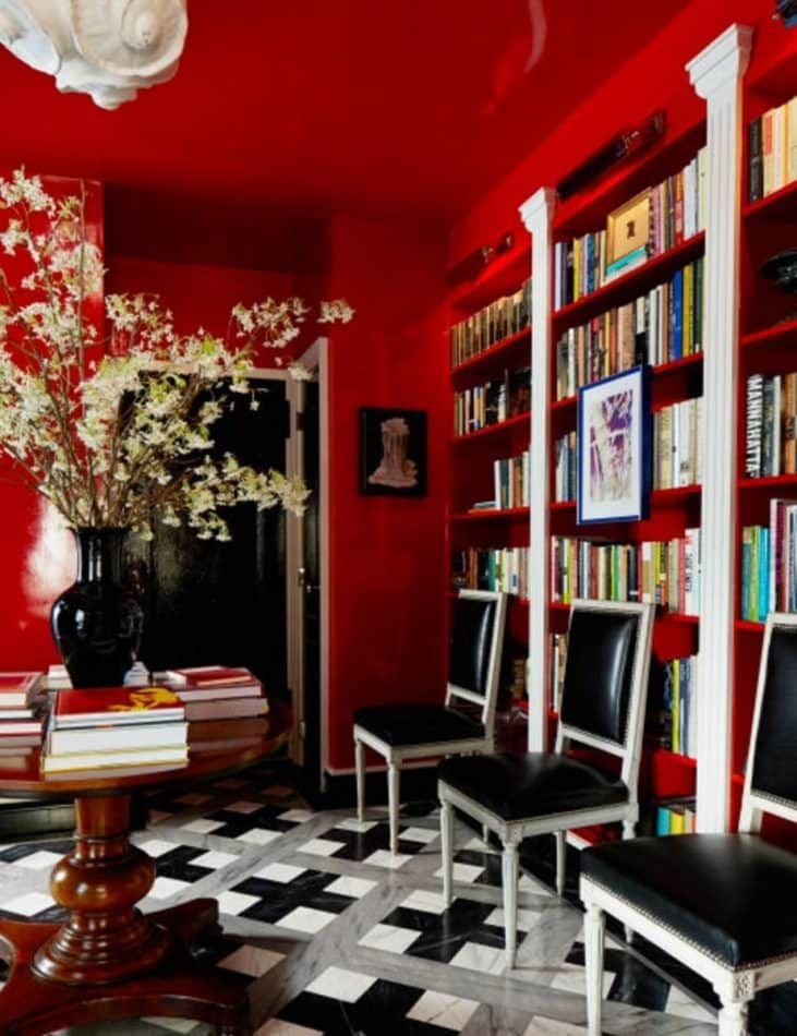 The red-lacquered walls and ceiling of this Nick Olsen–designed West Village apartment pop against the grey, white and black marble floor.