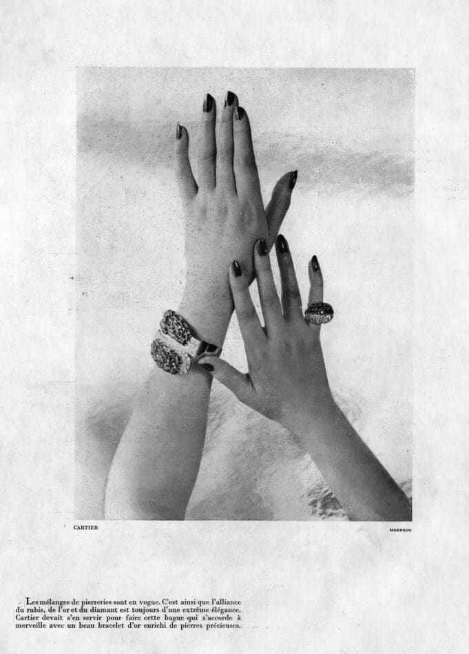 A black-and-white image of a page from a 1947 issue of French magazine "Femina" with a photo of a pair of hands wearing a Cartier ring and bracelet