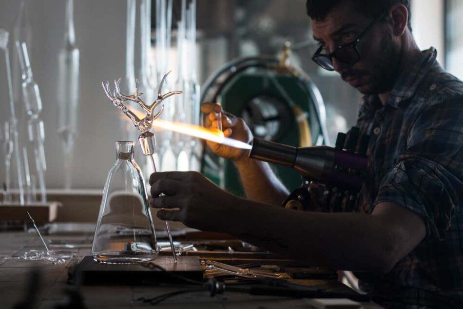 Simone Crestani works on his Trophy bottle set in his Camisano Vincenzo, Italy, atelier