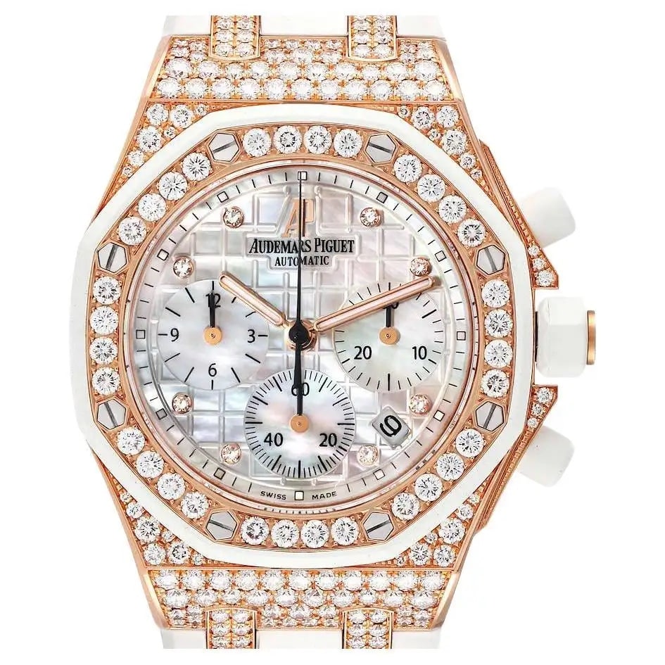 An Audemars Piguet Royal Oak Offshore in rose gold with a mother-of-pearl Tapisserie dial, diamond-studded bezel and case, and white strap