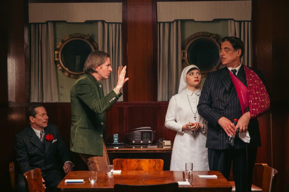 Wes Anderson on the set of The Phoenician Scheme with actors Mathieu Amalric, Mia Threapleton and Benicio del Toro