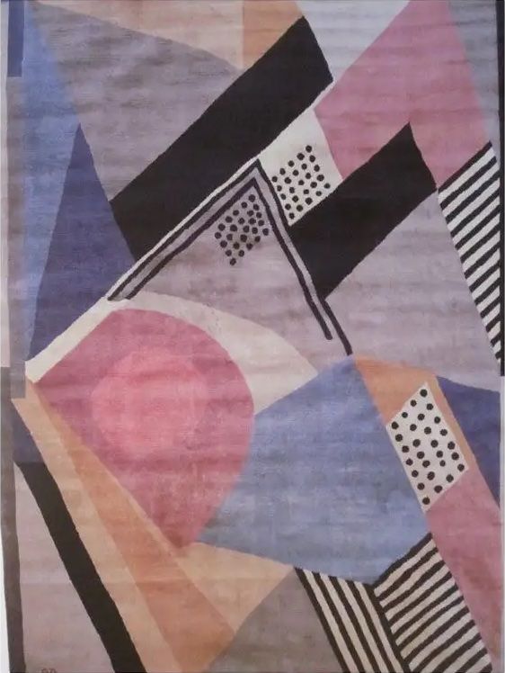 A pink-peach-and-purple Sonia Delaunay rug with black dots and stripes produced in 1970