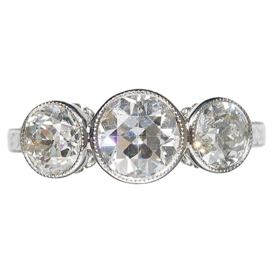 A platinum three-stone diamond engagement ring