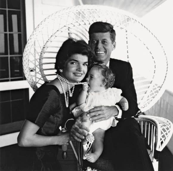 An infant Caroline Kennedy nabs her mother Jacqueline Kennedy's omnipresent strand of pearls in this 1958 photograph by Jacques Lowe. Offered by Peter Fetterman Gallery. 