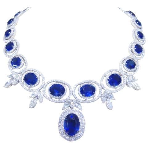 A sapphire and diamond necklace — featuring a 57-carat central pendant — set in 18 karat gold. Offered by Diamond Scene.