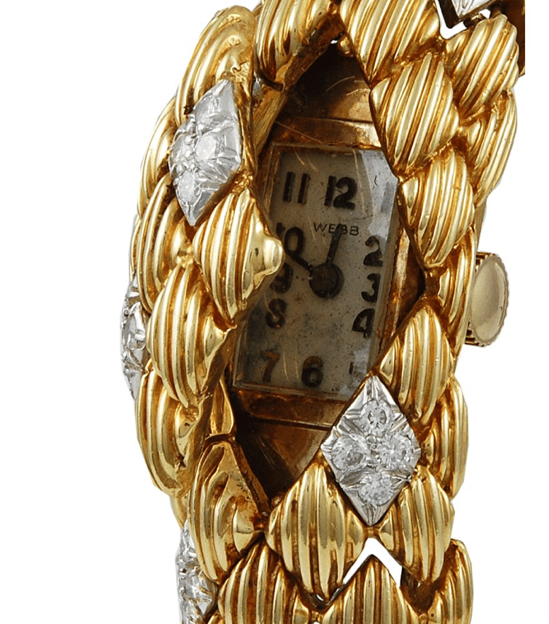A David Webb bracelet with a hinged flap partially open to reveal a rectangular watch face under the bracelet's surface