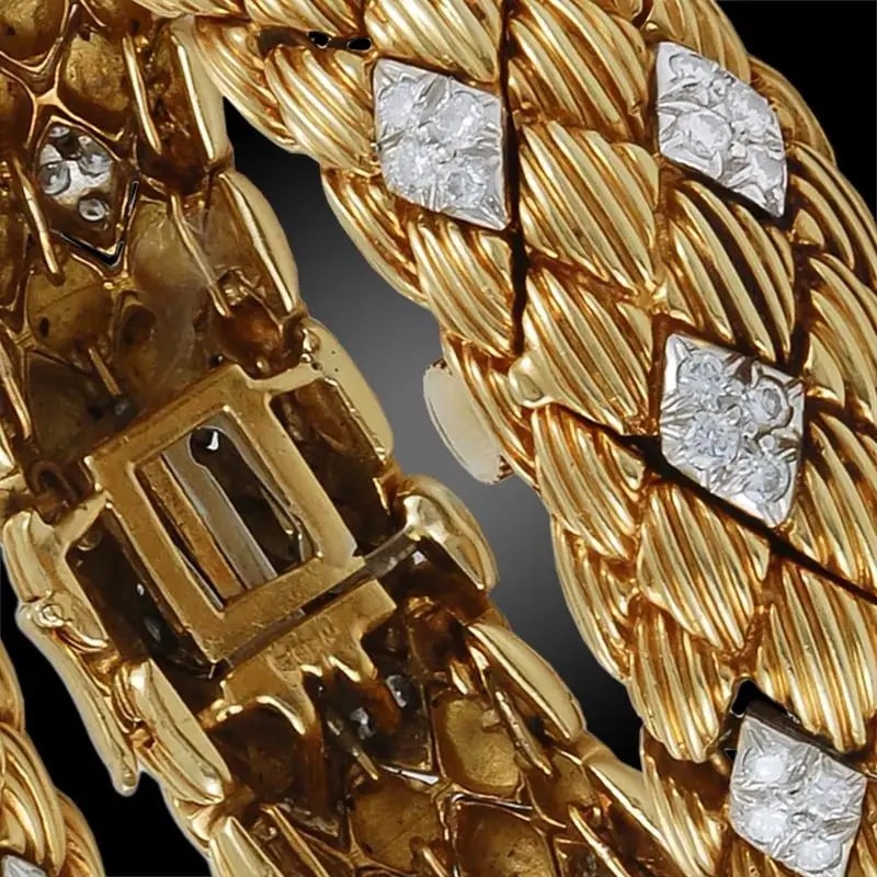 A closeup of a David Webb gold and diamond bracelet