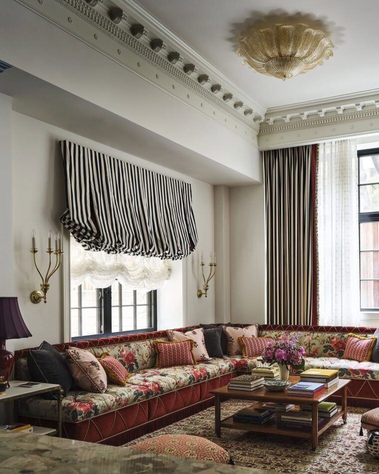 Living room with extra long sectional with floral upholstery