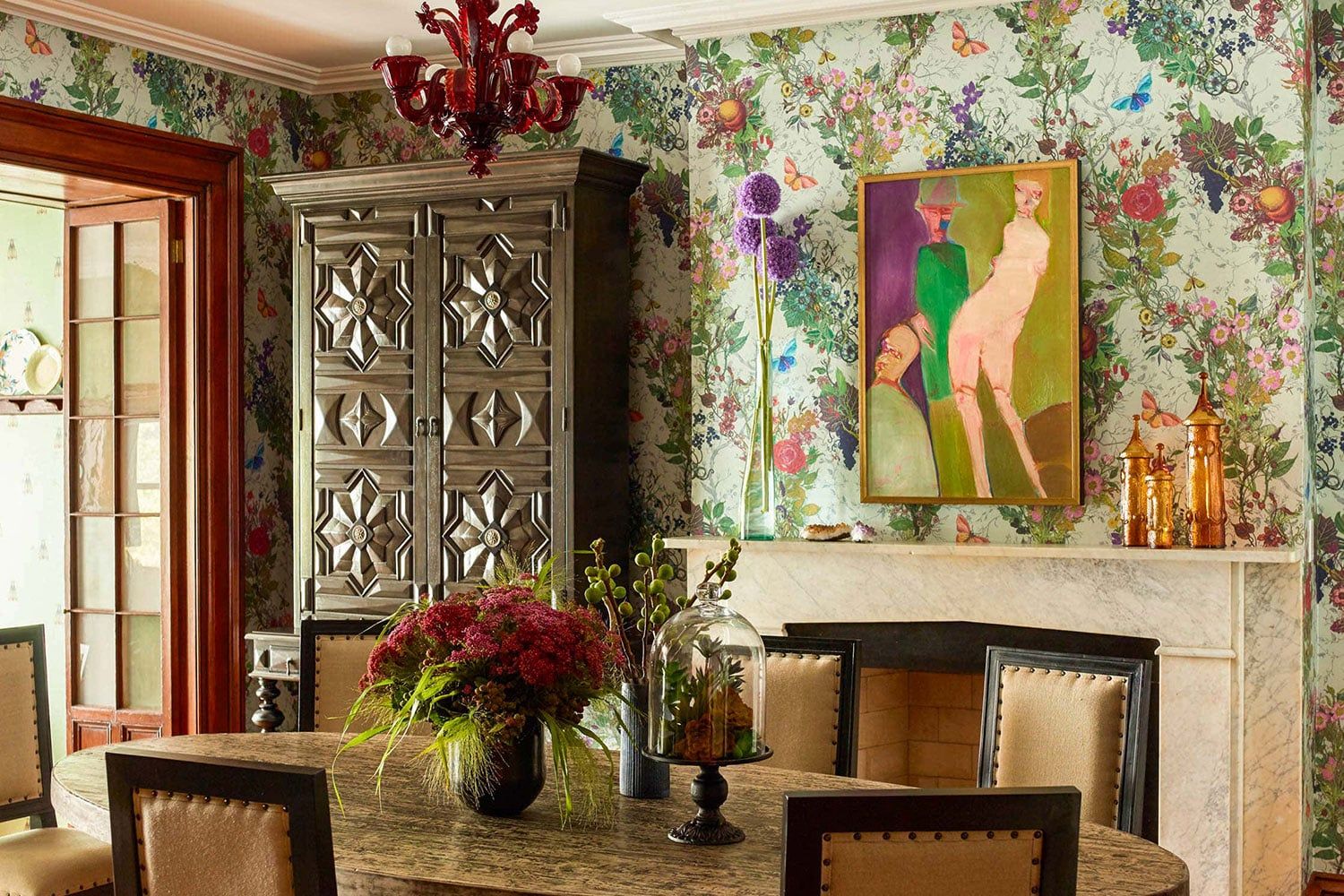 Victorian townhouse dining room with floral chintz wallpaper