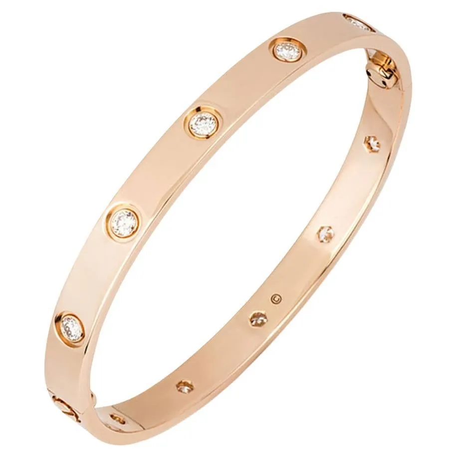 A rose-gold Cartier Love bracelet set with diamonds that are visible on the inner as well as the outer surface of the bracelet