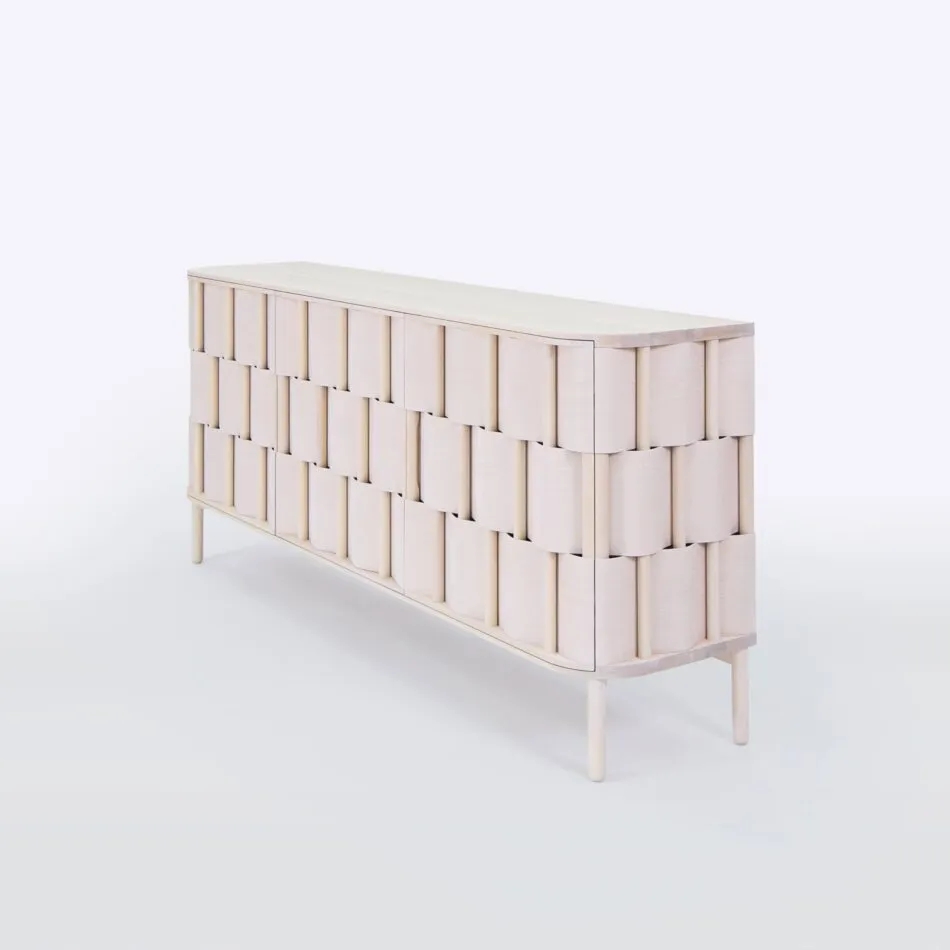 A creamy white Weave credenza designed by Lukas Dahlén features three tiers of woven wood beneath a flat tabletop. 