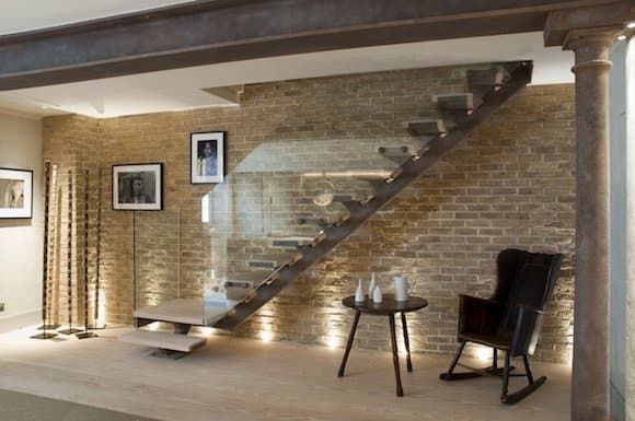 Tea can be taken under the stairs in this London townhouse by Riviere Interiors.