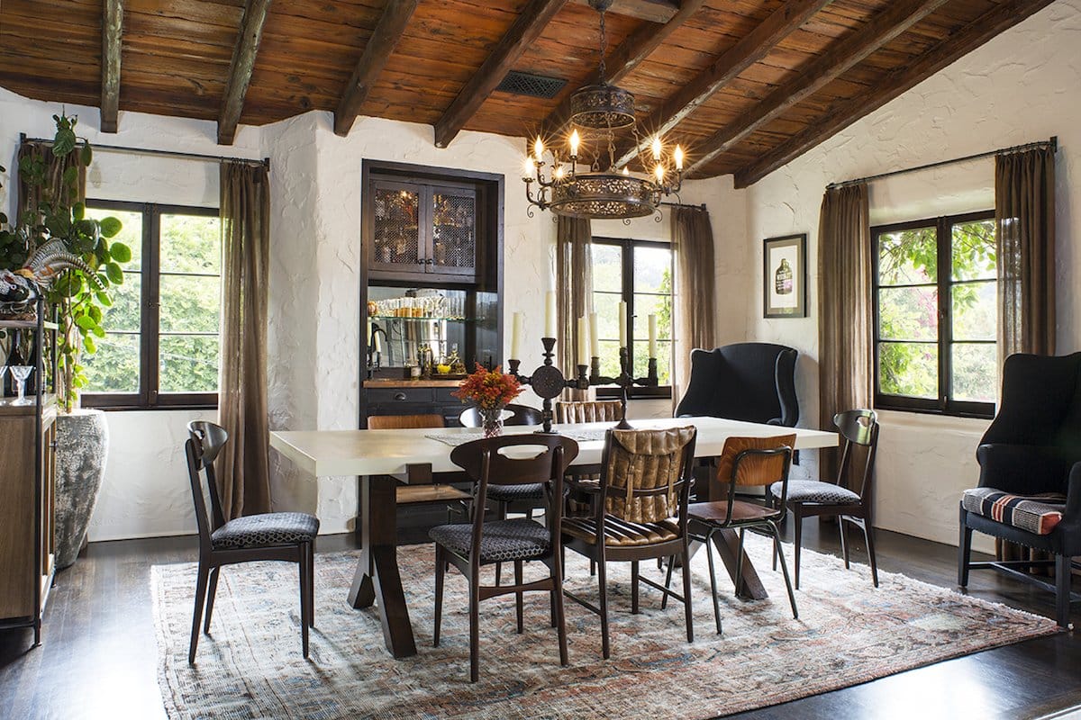 A variety of chairs are gathering around the table in this Los Angeles dining room by Deirdre Doherty.