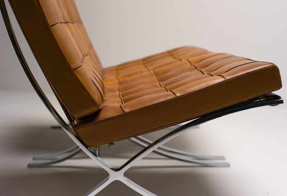 Detail of a Barcelona chair in cognac leather