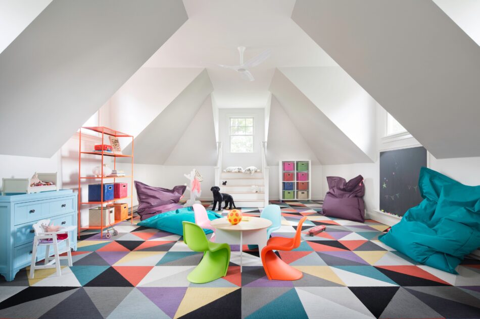 a children's playroom with a geometric rug