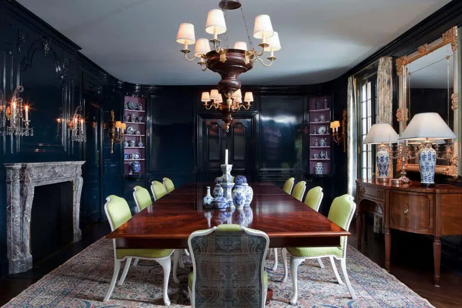 In designing this dining room in a historic estate in Greenwich, Connecticut, Kevin Isbell Interiors honored heritage and tradition with vintage pieces and a Persian rug