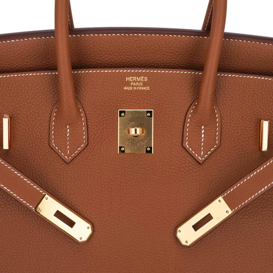 Close up of the detailed stitching on a brown Hermes Birkin Bag