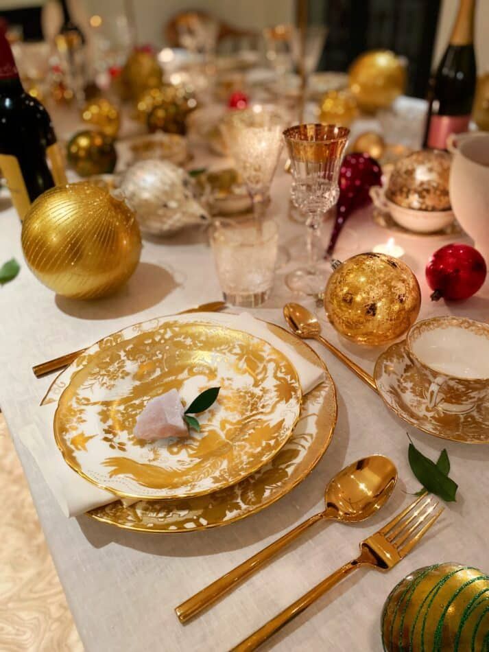 A golden place setting in Brigette Romanek's holiday tablescape