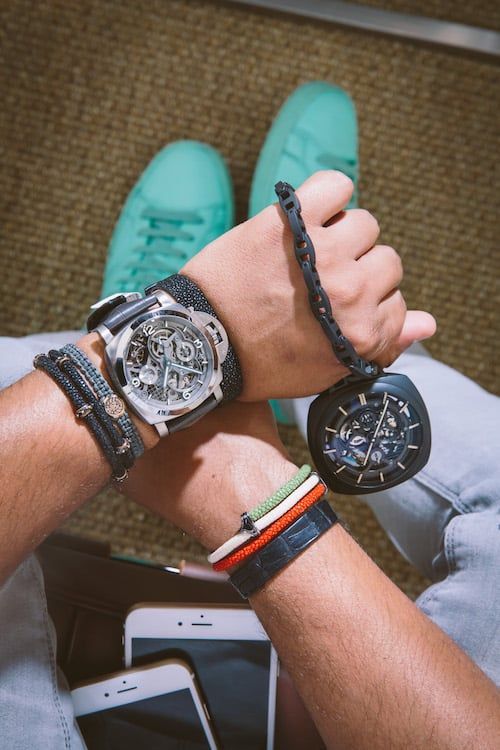 For a statement-making off-duty look, Bhatt wears colorful kicks and an oversize Panerai Lo Scienziato Luminor 1950 Tourbillon GMT Titanio. He's also holding a ceramic Panerai Pocket Watch Tourbillon GMT Ceramica.